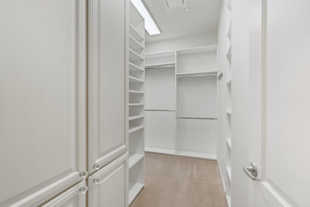 511 S Post Oak Ln Unit 2B, Houston, TX 77056 - walk in closet featuring light carpet