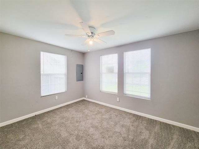 2928 Wayne St, Houston, TX 77026 - unfurnished room with electric panel, carpet floors, ceiling fan, and baseboards