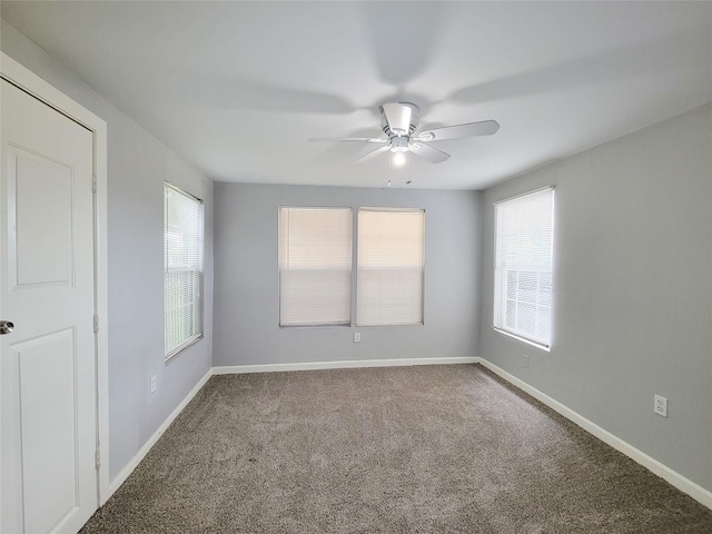 2928 Wayne St, Houston, TX 77026 - spare room featuring a ceiling fan, carpet flooring, and baseboards