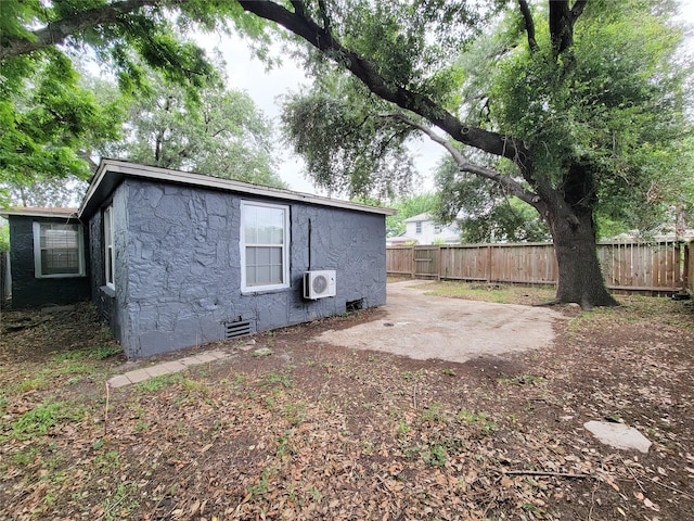 2928 Wayne St, Houston, TX 77026 - back of property featuring crawl space, a cooling unit, and a patio