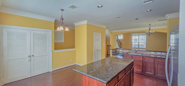 10722 Clearview Villa Pl, Houston, TX 77025 - kitchen with dishwasher, ornamental molding, dark wood-style floors, a center island, and a chandelier