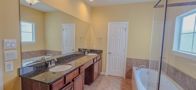 10722 Clearview Villa Pl, Houston, TX 77025 - full bath featuring a garden tub, double vanity, and tile patterned floors