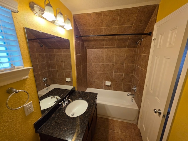 10722 Clearview Villa Pl, Houston, TX 77025 - bathroom featuring tile patterned flooring, washtub / shower combination, vanity, and a textured wall