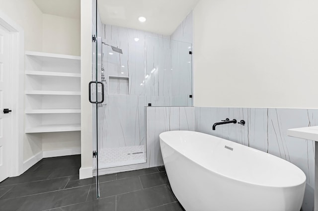 3632 Dreyfus St, Houston, TX 77021 - bathroom with a soaking tub, a shower stall, tile patterned floors, and a wainscoted wall