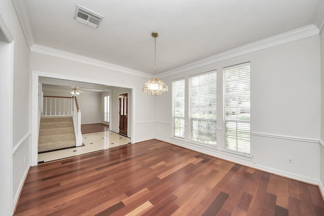 4311 Roaring Rapids Dr, Pasadena, TX 77059 - spare room with wood finished floors, stairway, ornamental molding, and a chandelier