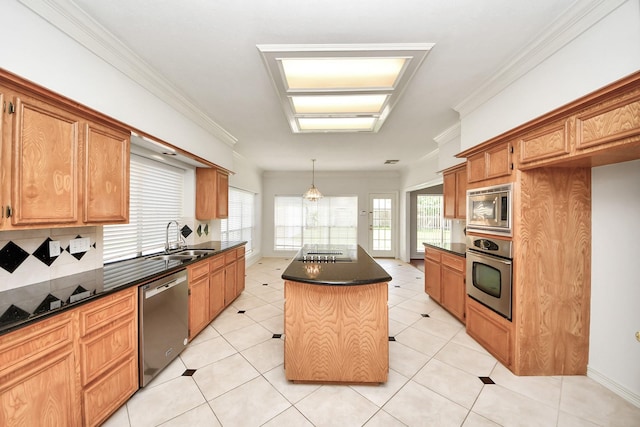 4311 Roaring Rapids Dr, Pasadena, TX 77059 - kitchen with stainless steel appliances, dark countertops, a sink, a kitchen island, and crown molding