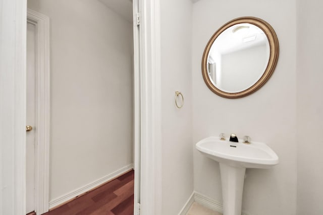 4311 Roaring Rapids Dr, Pasadena, TX 77059 - bathroom with wood finished floors and baseboards