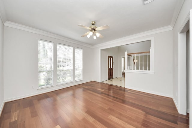 4311 Roaring Rapids Dr, Pasadena, TX 77059 - empty room featuring ceiling fan, wood finished floors, healthy amount of natural light, ornamental molding, and baseboards