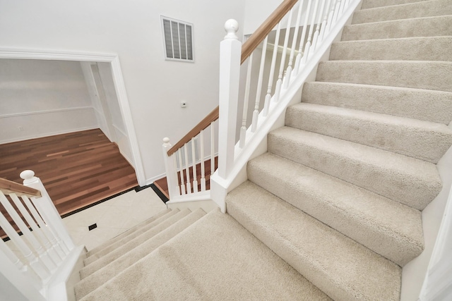 4311 Roaring Rapids Dr, Pasadena, TX 77059 - stairs featuring tile patterned floors and baseboards