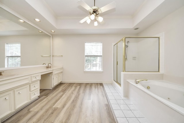 4311 Roaring Rapids Dr, Pasadena, TX 77059 - full bath featuring a tray ceiling, double vanity, a stall shower, a tub with jets, and recessed lighting