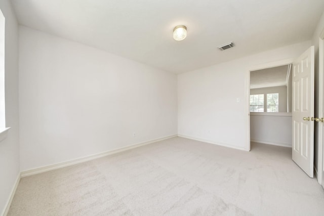 4311 Roaring Rapids Dr, Pasadena, TX 77059 - spare room featuring light carpet and baseboards