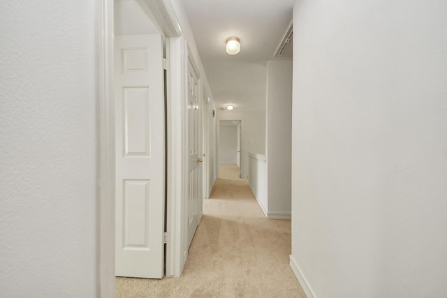 4311 Roaring Rapids Dr, Pasadena, TX 77059 - corridor with light carpet, attic access, and baseboards