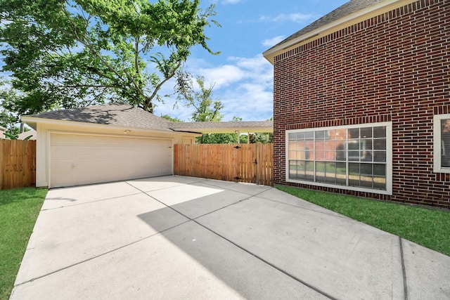 4311 Roaring Rapids Dr, Pasadena, TX 77059 - garage featuring concrete driveway and a gate
