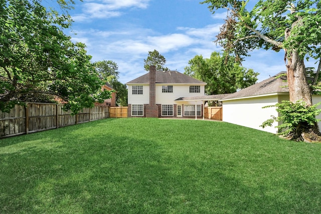 4311 Roaring Rapids Dr, Pasadena, TX 77059 - rear view of property with a chimney and brick siding