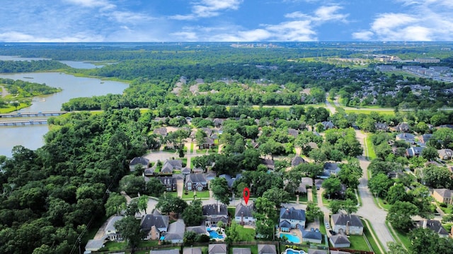 4311 Roaring Rapids Dr, Pasadena, TX 77059 - aerial view of property's location featuring a large body of water, a heavily wooded area, and nearby suburban area