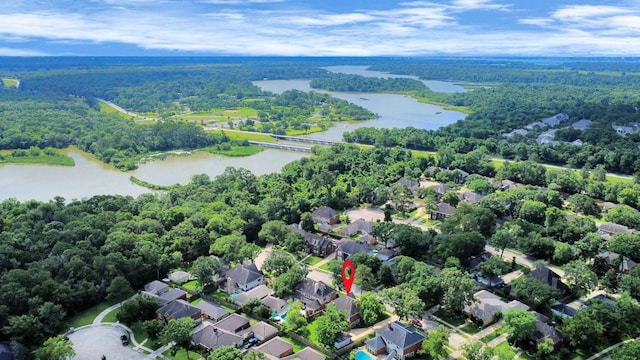 4311 Roaring Rapids Dr, Pasadena, TX 77059 - aerial view of property's location with a nearby body of water, a heavily wooded area, and nearby suburban area