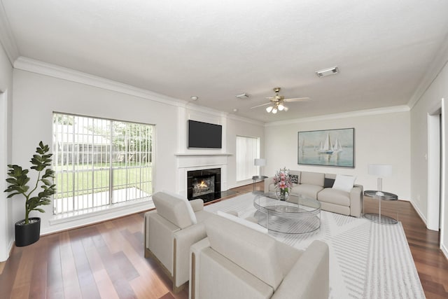 4311 Roaring Rapids Dr, Pasadena, TX 77059 - living area with ceiling fan, ornamental molding, wood finished floors, a tiled fireplace, and baseboards