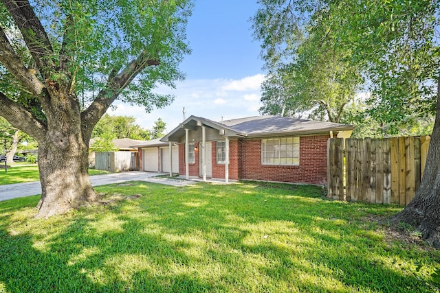 231 Gruss Dr, Houston, TX 77060 - single story home with an attached garage, concrete driveway, and brick siding