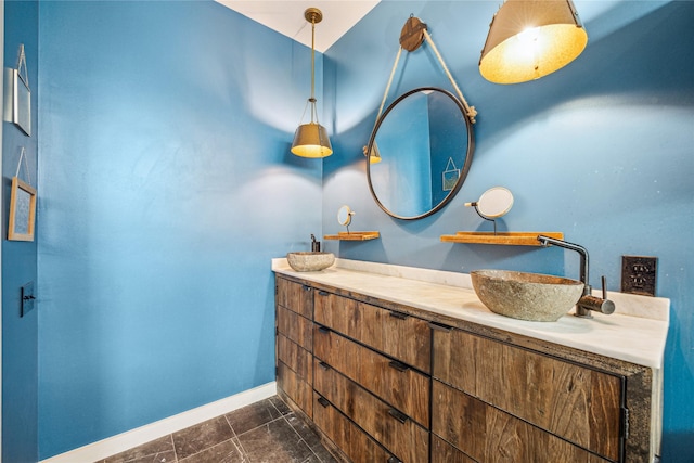 429 Meadow St, Houston, TX 77020 - bathroom with baseboards, double vanity, and tile patterned floors