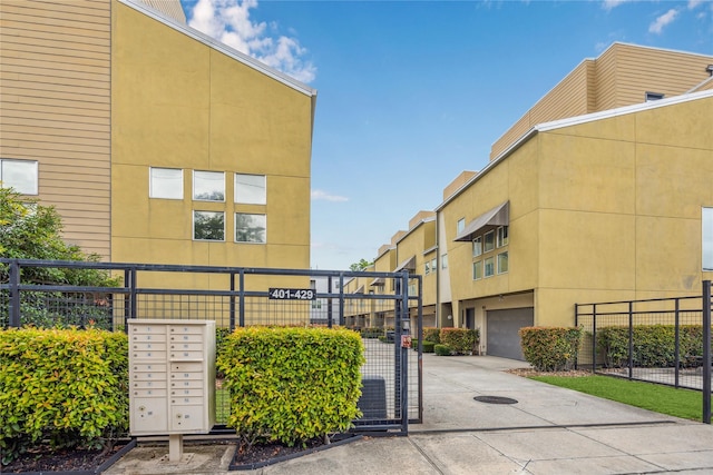 429 Meadow St, Houston, TX 77020 - view of building exterior with an attached garage and driveway