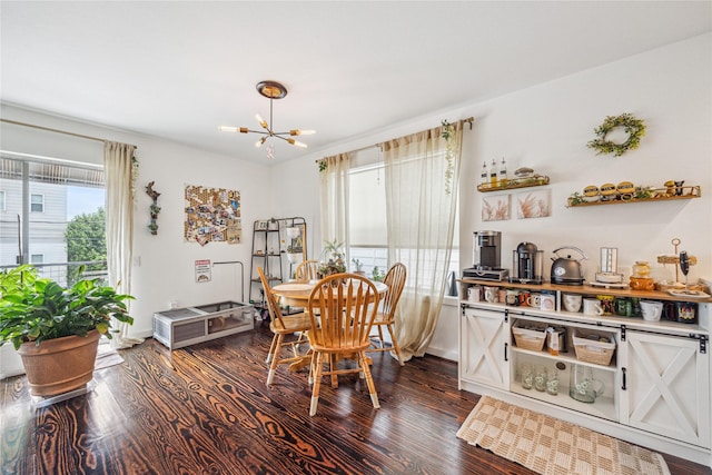 429 Meadow St, Houston, TX 77020 - dining room featuring healthy amount of natural light, a chandelier, dark wood-style flooring, and baseboards