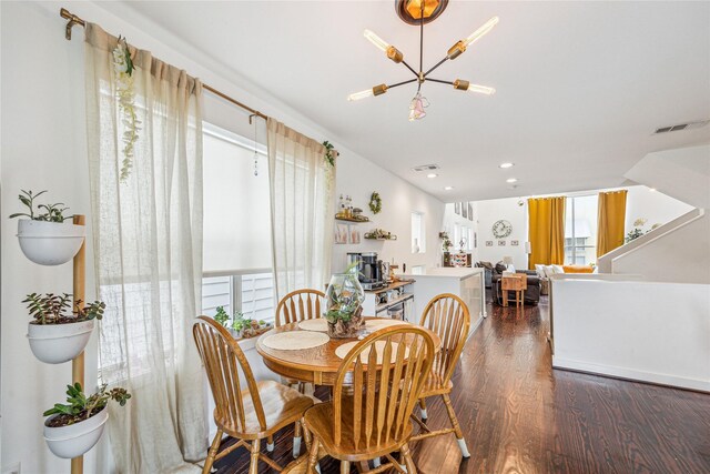 429 Meadow St, Houston, TX 77020 - dining room with wood finished floors, a chandelier, and recessed lighting