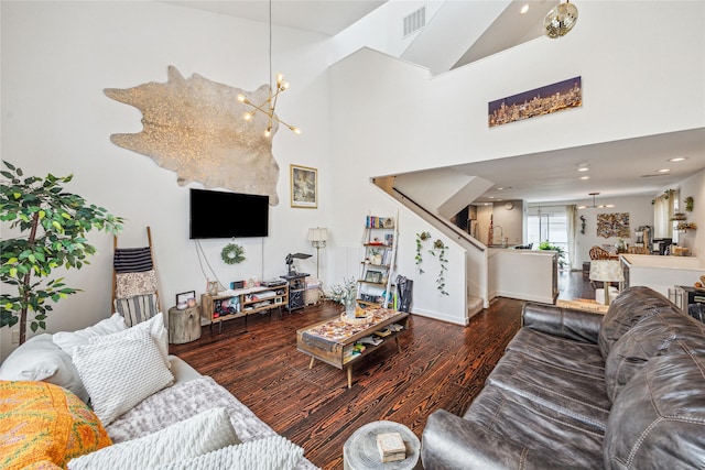 429 Meadow St, Houston, TX 77020 - living room featuring a chandelier, wood finished floors, stairway, baseboards, and recessed lighting
