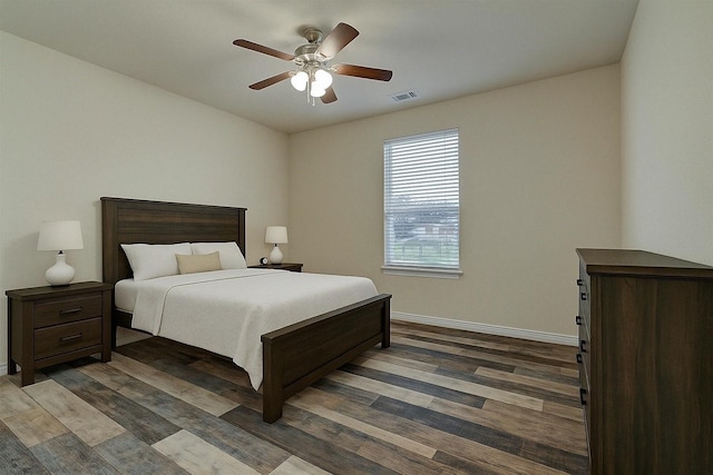 11848 Seashell Cir, Montgomery, TX 77356 - bedroom with dark wood-style flooring, baseboards, and a ceiling fan