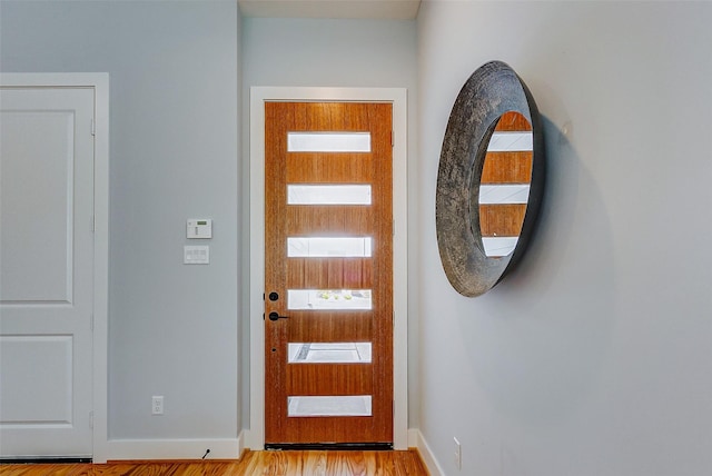 1852 W Tidwell Rd, Houston, TX 77091 - doorway to outside with light wood-style floors and baseboards