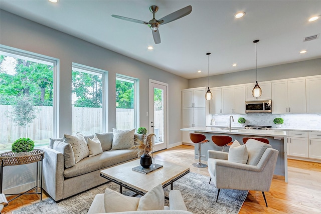 1852 W Tidwell Rd, Houston, TX 77091 - living area featuring ceiling fan, recessed lighting, and light wood finished floors