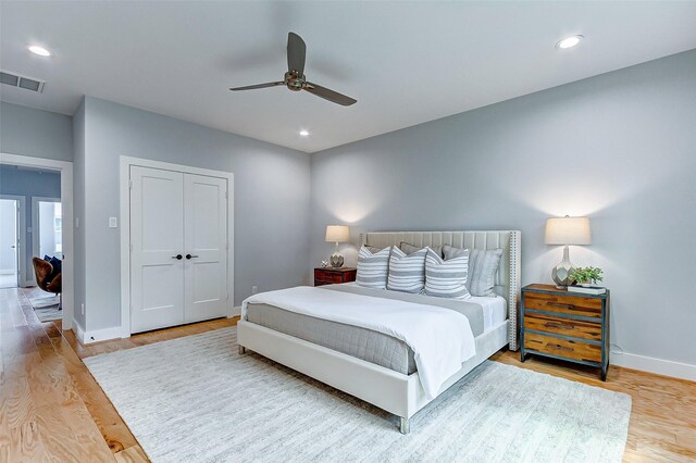 1830 W Tidwell Rd, Houston, TX 77091 - bedroom with wood finished floors, a closet, a ceiling fan, and recessed lighting