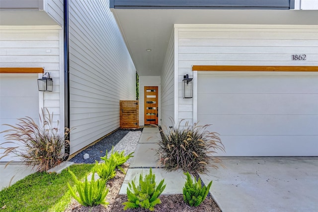 1830 W Tidwell Rd, Houston, TX 77091 - view of exterior entry featuring a garage