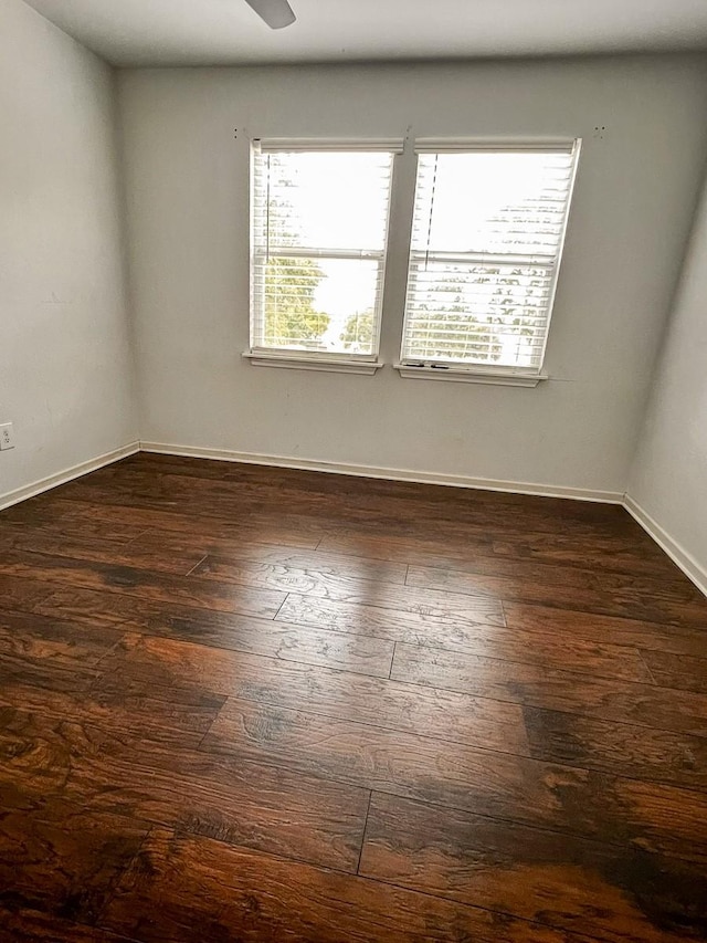 239 Cove Vw, Trinity, TX 75862 - empty room featuring dark wood finished floors, baseboards, and ceiling fan