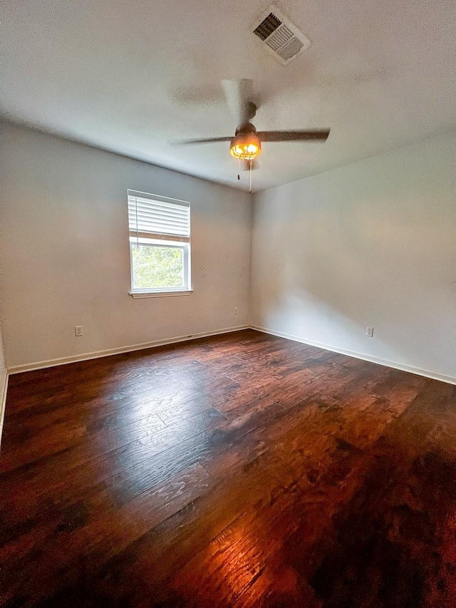 239 Cove Vw, Trinity, TX 75862 - unfurnished room with ceiling fan, baseboards, and dark wood-type flooring