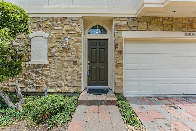 8806 Lakeshore Bend Dr, Houston, TX 77080 - property entrance with stone siding and a garage