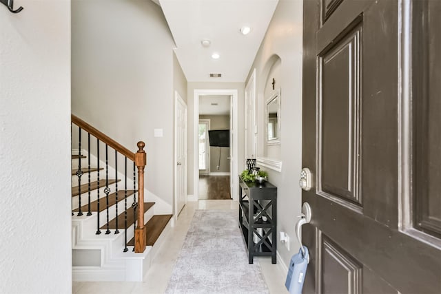 8806 Lakeshore Bend Dr, Houston, TX 77080 - foyer entrance featuring stairway and baseboards