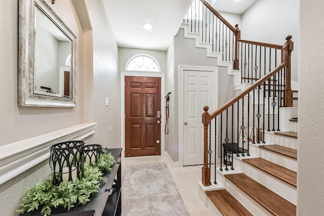 8806 Lakeshore Bend Dr, Houston, TX 77080 - foyer entrance featuring tile patterned flooring and stairway