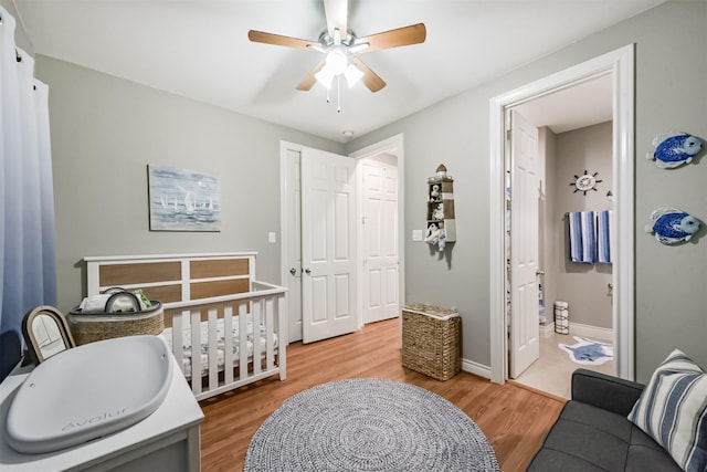 8806 Lakeshore Bend Dr, Houston, TX 77080 - bedroom featuring light wood-style floors, ensuite bathroom, and ceiling fan