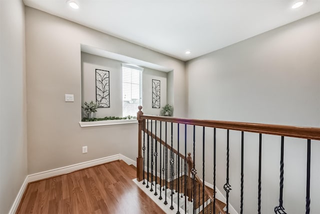 8806 Lakeshore Bend Dr, Houston, TX 77080 - corridor with an upstairs landing, wood finished floors, and recessed lighting
