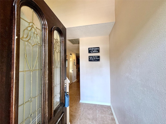 3823 Knollcrest Dr, Montgomery, TX 77356 - corridor featuring tile patterned flooring, baseboards, and a textured wall