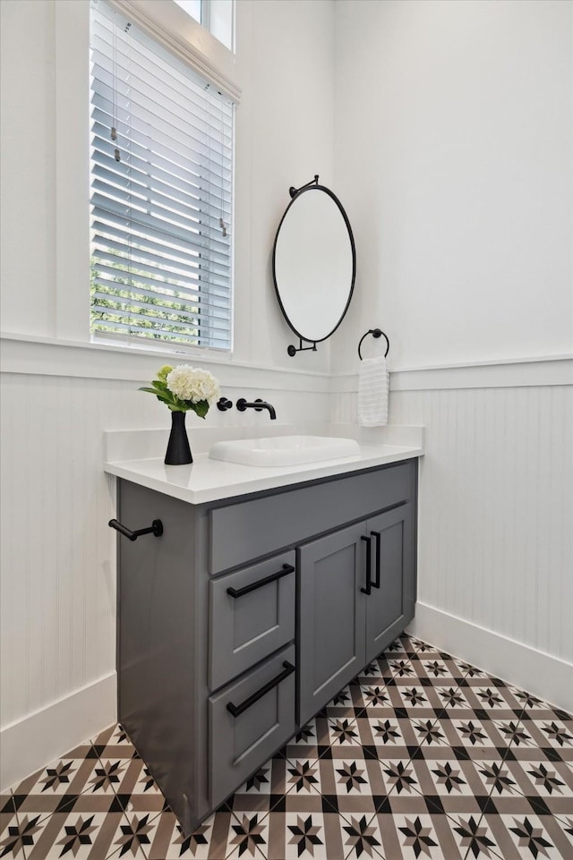 1402 Missouri Unit B, Houston, TX 77006 - bathroom with a wainscoted wall, vanity, baseboards, and tile patterned floors