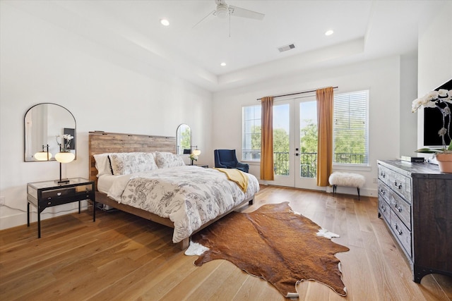 1402 Missouri Unit B, Houston, TX 77006 - bedroom featuring a raised ceiling, french doors, light wood-style flooring, access to outside, and recessed lighting