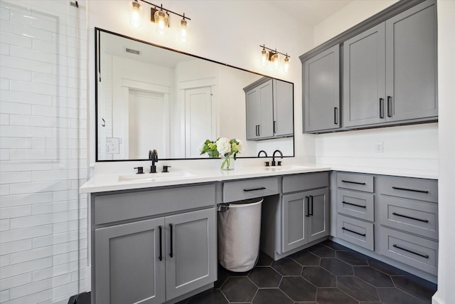 1402 Missouri Unit B, Houston, TX 77006 - full bathroom with double vanity and tile patterned floors