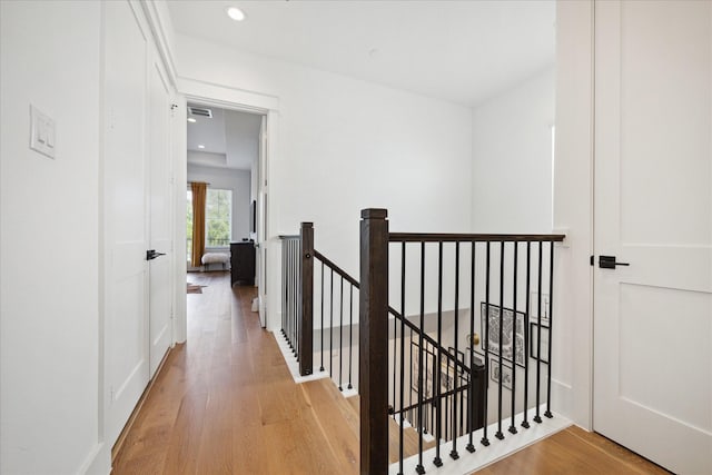 1402 Missouri Unit B, Houston, TX 77006 - hallway featuring an upstairs landing, light wood finished floors, and recessed lighting