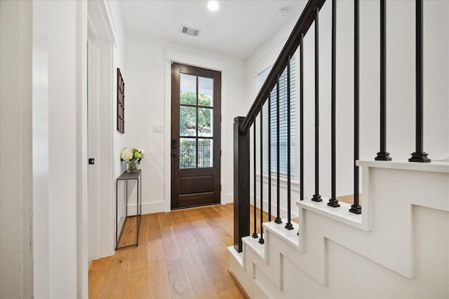 1402 Missouri Unit B, Houston, TX 77006 - entrance foyer with light wood-style flooring, baseboards, stairs, and recessed lighting