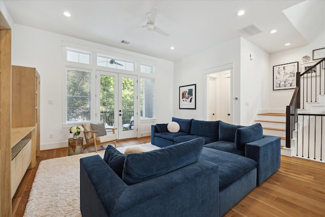1402 Missouri Unit B, Houston, TX 77006 - living area featuring a ceiling fan, wood finished floors, stairway, baseboards, and french doors