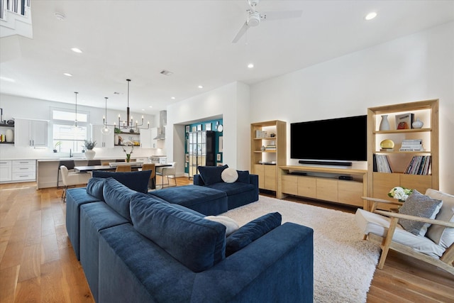 1402 Missouri Unit B, Houston, TX 77006 - living area featuring light wood finished floors, a ceiling fan, and recessed lighting