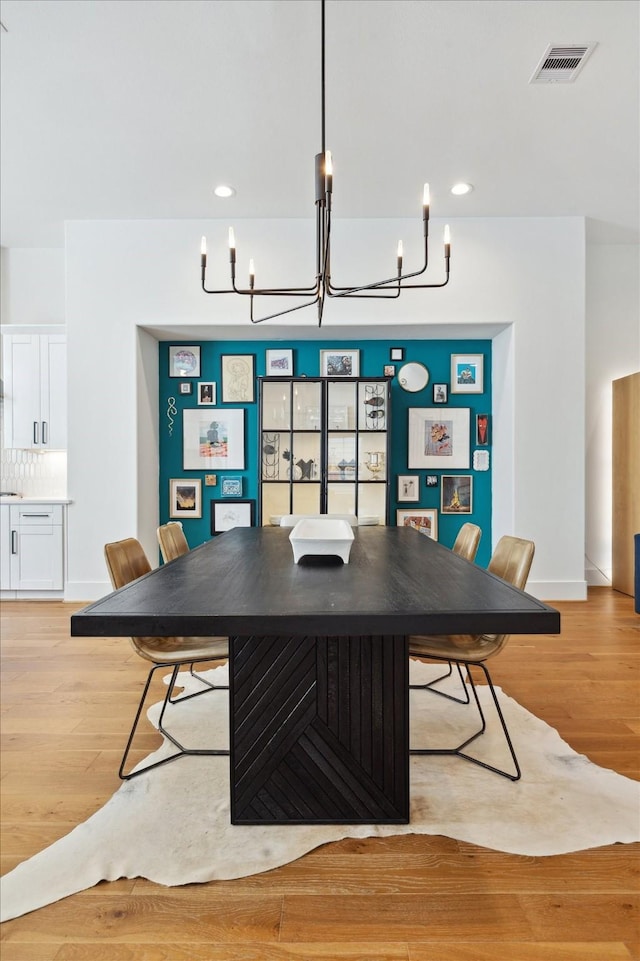 1402 Missouri Unit B, Houston, TX 77006 - dining area with a chandelier, light wood-style floors, baseboards, and recessed lighting