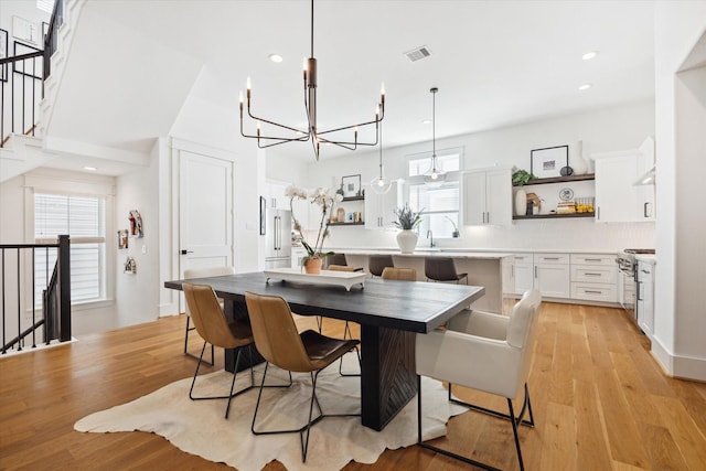 1402 Missouri Unit B, Houston, TX 77006 - dining area featuring a chandelier, light wood-style floors, and recessed lighting