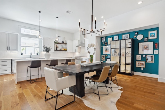 1402 Missouri Unit B, Houston, TX 77006 - dining space featuring recessed lighting, a chandelier, light wood finished floors, and baseboards
